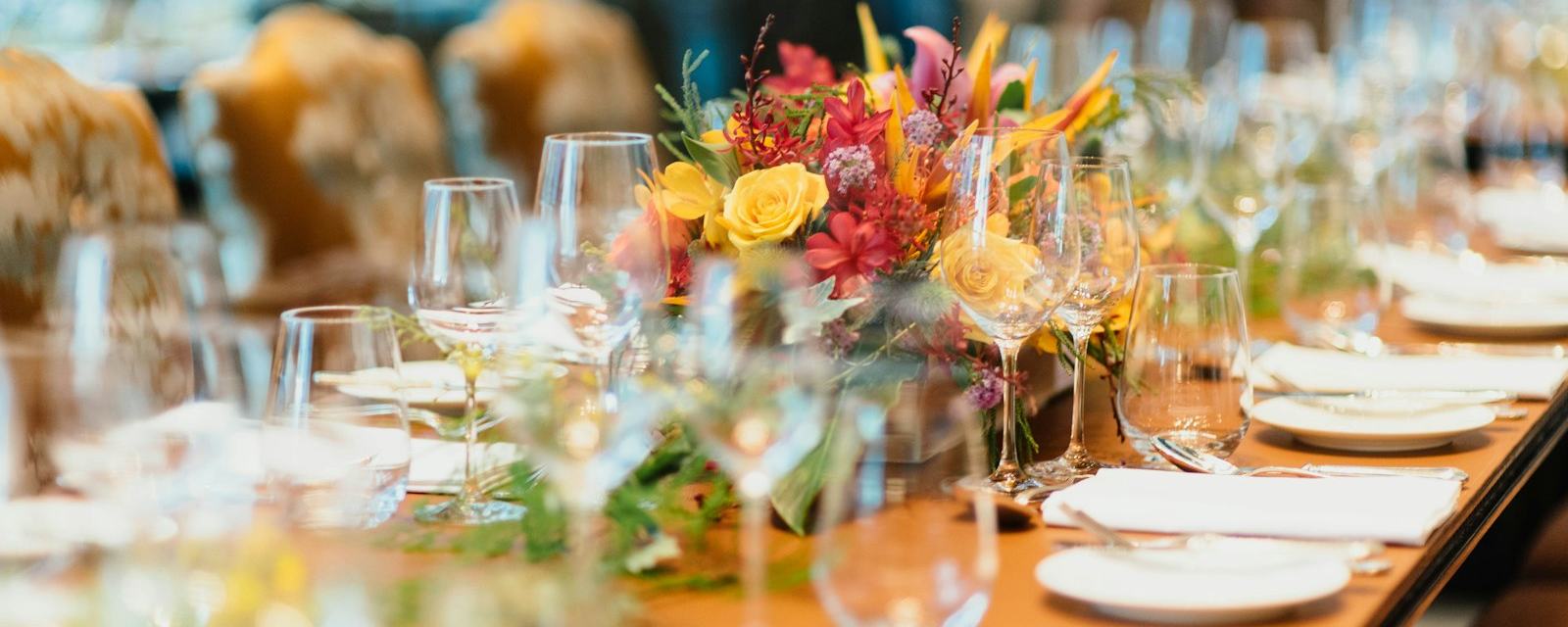 An elegant event table with a floral centerpiece